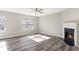 Spacious living room with fireplace and wood-look flooring at 5667 Cascade Sw Run, Atlanta, GA 30336