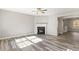 Bright living room features a fireplace and hardwood floors at 5667 Cascade Sw Run, Atlanta, GA 30336