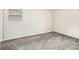 Empty bedroom with gray carpeting and a large window at 821 Peeples Valley Nw Rd, Cartersville, GA 30121