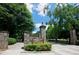 Stone entrance to Piedmont Park, featuring lush landscaping and park sign at 266 11Th Ne St # 308, Atlanta, GA 30309