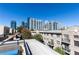 Rooftop deck with city views and seating area at 266 11Th Ne St # 308, Atlanta, GA 30309