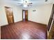 Bright bedroom featuring wood flooring and ceiling fan at 342 Mccurry Rd, Stockbridge, GA 30281