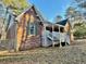 Brick house with a covered porch and a fenced yard at 342 Mccurry Rd, Stockbridge, GA 30281