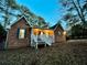 Brick ranch house with a covered porch and landscaped yard at 342 Mccurry Rd, Stockbridge, GA 30281