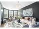 Elegant living room featuring a neutral color palette, plush seating, and a stunning chandelier at 625 Birkdale Dr, Fairburn, GA 30213