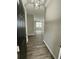 Inviting entryway with wood-look flooring and view to living area at 671 Bedford Ct, Woodstock, GA 30188