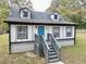 Cute cottage with gray steps, blue door, and white siding at 2933 5Th Sw St, Atlanta, GA 30315