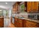 Modern kitchen with double sink, granite counters and wood cabinets at 4050 Annecy Dr, Atlanta, GA 30331