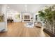 Bright and airy living room with hardwood floors, a fireplace, and abundant natural light at 4619 Brunning Ct, Dunwoody, GA 30338