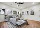 Spacious main bedroom with light gray bedding, large windows, and ceiling fan at 1073 Mayson Turner Nw Rd, Atlanta, GA 30314