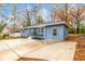 Updated blue house with a large concrete driveway and yard at 2899 Gresham Se Rd, Atlanta, GA 30316