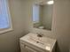 Clean bathroom with a white vanity and a large mirror at 5085 Rock Glen Dr, Stone Mountain, GA 30088