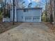 Two-story house with attached two-car garage and long driveway at 5085 Rock Glen Dr, Stone Mountain, GA 30088