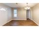 Dining room features wood-look floors and a chandelier at 3358 Orange Blossom Rd, Decatur, GA 30034