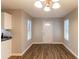 Dining area with wood-look flooring and access to kitchen at 3358 Orange Blossom Rd, Decatur, GA 30034