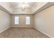 Spacious main bedroom with neutral walls and carpet at 3358 Orange Blossom Rd, Decatur, GA 30034