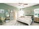 Serene bedroom with light green walls and a comfy bed at 115 Asher Dr, Carrollton, GA 30116