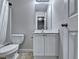 Clean bathroom with white vanity and shower/tub combo at 1597 Liberty Nw Pkwy, Atlanta, GA 30318