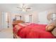 Large bedroom with dresser and red bedding at 2793 Jordan Forest Trl, Lawrenceville, GA 30044