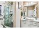 Elegant bathroom with a frameless glass shower, marble tile, and modern vanity at 120 Broad Meadows Ln, Fayetteville, GA 30215