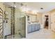 Spa-like bathroom featuring a large walk-in shower, gray cabinets, and marble floors at 120 Broad Meadows Ln, Fayetteville, GA 30215
