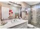 Modern bathroom with quartz countertop, floating shelves, and a glass shower at 120 Broad Meadows Ln, Fayetteville, GA 30215