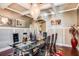 Formal dining room with a glass table and modern chandelier at 120 Broad Meadows Ln, Fayetteville, GA 30215