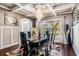 Elegant dining room features a large glass table, chandelier, and hardwood floors at 120 Broad Meadows Ln, Fayetteville, GA 30215