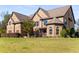 Brick house with a large front yard and mature landscaping at 120 Broad Meadows Ln, Fayetteville, GA 30215