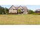 Brick two-story house with a large front yard at 120 Broad Meadows Ln, Fayetteville, GA 30215