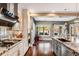 Spacious kitchen with granite countertops, stainless steel appliances, and hardwood floors at 120 Broad Meadows Ln, Fayetteville, GA 30215