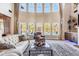 Bright living room with wall of windows, plush seating, and a cozy atmosphere at 120 Broad Meadows Ln, Fayetteville, GA 30215
