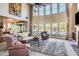 Spacious living room with vaulted ceiling, large windows, and comfortable seating at 120 Broad Meadows Ln, Fayetteville, GA 30215