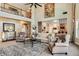 Two-story living room with a large statement art piece and comfortable seating at 120 Broad Meadows Ln, Fayetteville, GA 30215