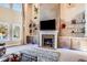 Spacious living room features a fireplace and built-in shelving at 120 Broad Meadows Ln, Fayetteville, GA 30215