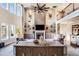 Two-story living room with a large fireplace and high ceilings at 120 Broad Meadows Ln, Fayetteville, GA 30215