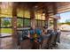 Brick outdoor kitchen with seating area and poolside access at 120 Broad Meadows Ln, Fayetteville, GA 30215