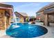 Luxury pool with a waterfall feature and spacious patio area at 120 Broad Meadows Ln, Fayetteville, GA 30215