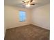 Simple bedroom with white walls, carpet flooring, and a window with blinds at 2765 Hunters Pond Ln, Snellville, GA 30078