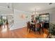 Dining room with hardwood floors, chandelier, and a view of the entryway at 2773 Saddle Horn Pl, Snellville, GA 30039