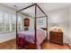 Charming bedroom with wood floors and a four-poster bed at 1717 N Decatur Ne Rd # 214, Atlanta, GA 30307