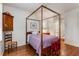 Bedroom with hardwood floors, four-poster bed, and built-in wardrobe at 1717 N Decatur Ne Rd # 214, Atlanta, GA 30307