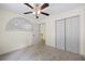 Bedroom with carpet, ceiling fan, and double closets at 2331 Suwanee Pointe Dr, Lawrenceville, GA 30043