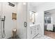 Spa-like bathroom with walk-in shower, double vanity, and marble floors at 715 N Evelyn Nw Pl, Atlanta, GA 30318