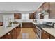 Modern kitchen with stainless steel appliances and an island, offering plenty of counter and cabinet space at 242 Edinburgh Ln, Woodstock, GA 30188