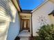 Inviting front entrance with a wood door and decorative metalwork at 75 Briar Patch Rd, Covington, GA 30014