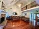 Vaulted ceiling living room with hardwood floors and fireplace at 75 Briar Patch Rd, Covington, GA 30014