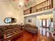 Spacious living room featuring hardwood floors and a vaulted ceiling at 75 Briar Patch Rd, Covington, GA 30014