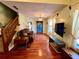 Living area with hardwood floors and a cozy sitting area at 75 Briar Patch Rd, Covington, GA 30014