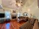 Living room with hardwood floors, stone fireplace, and large windows at 75 Briar Patch Rd, Covington, GA 30014